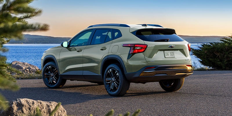 A 2024 Chevrolet Trax driving along a scenic road